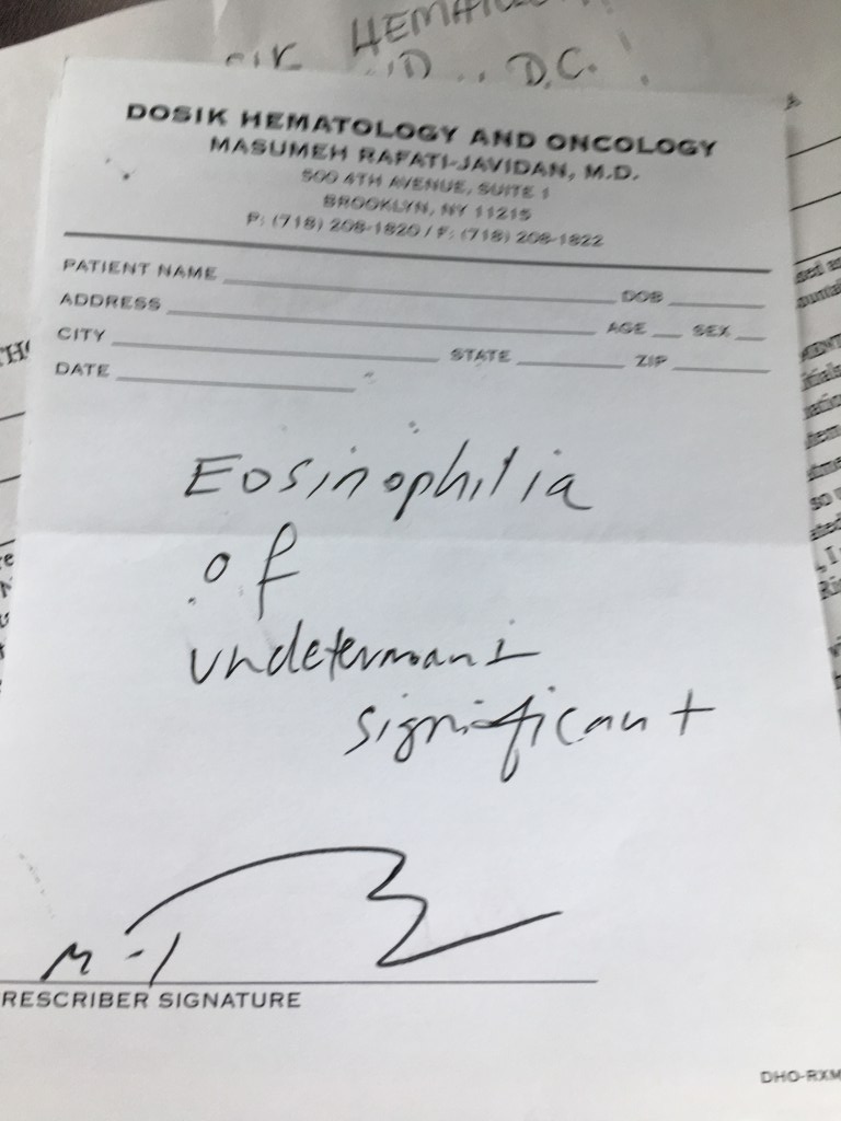 Picture of paper prescription pad from Dosik Hematology and Oncology with handwritten text "Eosinophilia of undetermined significance."